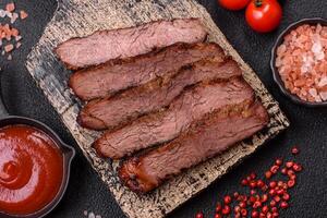 Grilled wagyu beef tomahawk steak with salt, spices and herbs photo