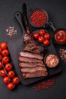 Grilled wagyu beef tomahawk steak with salt, spices and herbs photo
