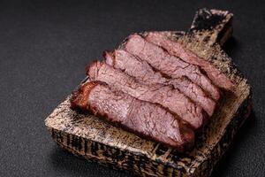 Grilled wagyu beef tomahawk steak with salt, spices and herbs photo