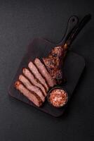 Grilled wagyu beef tomahawk steak with salt, spices and herbs photo