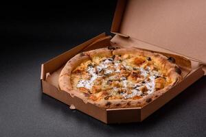 Creamy pizza with truffle cheese, mozzarella, chicken and mushrooms photo