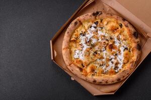 Creamy pizza with truffle cheese, mozzarella, chicken and mushrooms photo