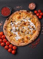 Creamy pizza with truffle cheese, mozzarella, chicken and mushrooms photo