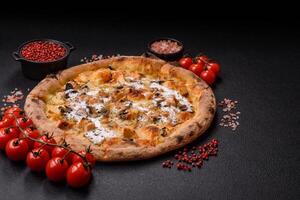 Creamy pizza with truffle cheese, mozzarella, chicken and mushrooms photo