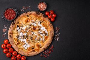 Creamy pizza with truffle cheese, mozzarella, chicken and mushrooms photo