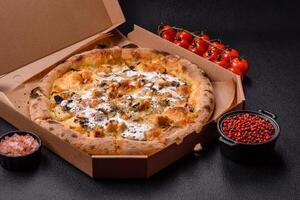 Creamy pizza with truffle cheese, mozzarella, chicken and mushrooms photo