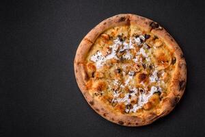 Creamy pizza with truffle cheese, mozzarella, chicken and mushrooms photo