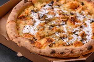 Creamy pizza with truffle cheese, mozzarella, chicken and mushrooms photo