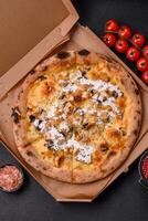 Creamy pizza with truffle cheese, mozzarella, chicken and mushrooms photo