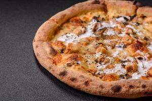 Creamy pizza with truffle cheese, mozzarella, chicken and mushrooms photo
