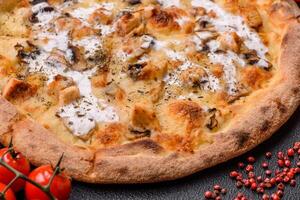 Creamy pizza with truffle cheese, mozzarella, chicken and mushrooms photo