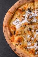 Creamy pizza with truffle cheese, mozzarella, chicken and mushrooms photo