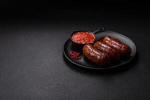 Juicy sausages with salt, spices and herbs photo