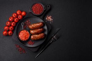 Juicy sausages with salt, spices and herbs photo