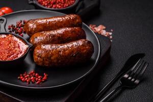 Juicy sausages with salt, spices and herbs photo