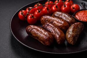 Juicy sausages with salt, spices and herbs photo