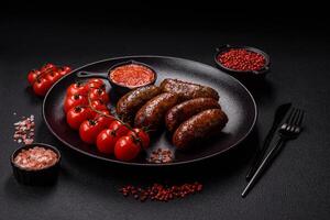 Juicy sausages with salt, spices and herbs photo
