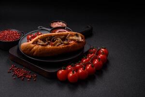 Hotdog with grilled sausage with bacon and mushrooms photo