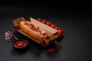 Hotdog with grilled sausage with bacon and mushrooms photo