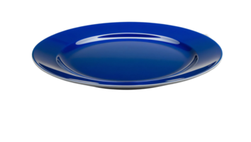Round blue ceramic dinner plate with a glossy surface, perfect for serving meals or for decorative use in modern table settings. Isolated on transparent background png
