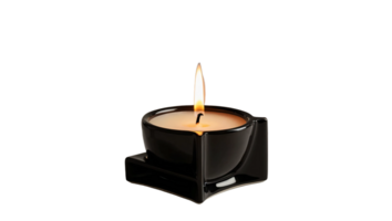 A lit candle placed inside a geometric black ceramic holder, featuring a modern and minimalist design. The flame emits a warm glow. Isolated on transparent background png