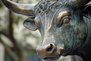 Bronze bull sculpture representing financial prosperity and success photo