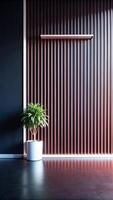 A plant in a pot on a table in front of a wall photo