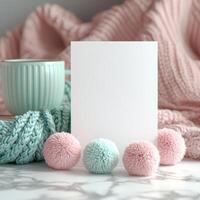 Cozy White Greeting Card Mockup with Knit Yarn Pom Poms photo