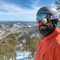 Smiling skier enjoying mountain view in winter vacation photo