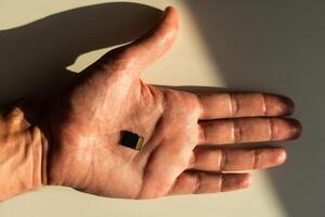 SD card Or memory card in hand concept of technology and in form of background. photo