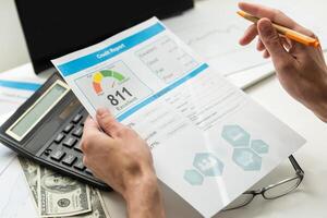 The man checks the credit report and how many credit points. photo