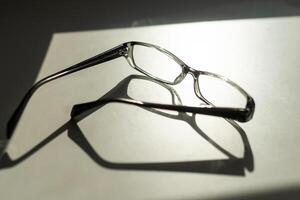 Black frame eyeglasses isolated on white background, Myopia, Short sighted or presbyopia eyeglasses. photo