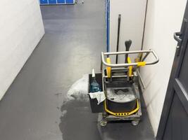 Closeup of cleaning equipments and tools for floor cleaning in the building at the airport. photo
