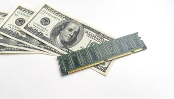 Computer CPU and memory chips on US dollar banknotes background. The high cost of microelectronics concept photo