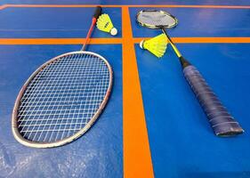 Competitive sports and high performance in tournament match conceptual idea with badminton rackets and shuttlecock with copy space photo