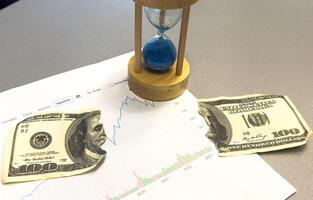 Financial planning objects - piggy bank, graph a colour background. photo