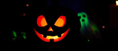 glowing jack-o'-lantern with a ghostly figure the background photo