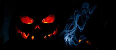 glowing jack-o'-lantern a smoky skull photo
