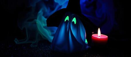 glowing ghost stands before a lit pink candle photo