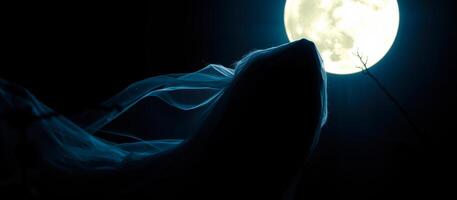 shadowy figure stands under the light the full moon photo