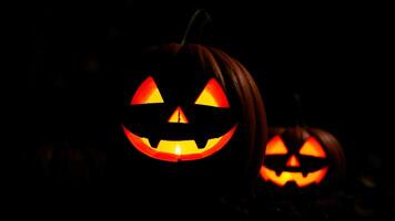 smiling jack-o'-lanterns glowing the dark photo
