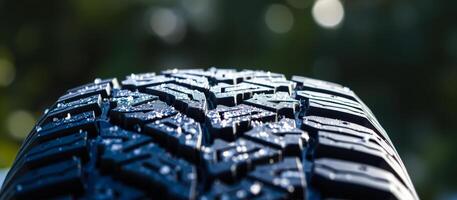 close- a wet tire tread with a blurred background photo
