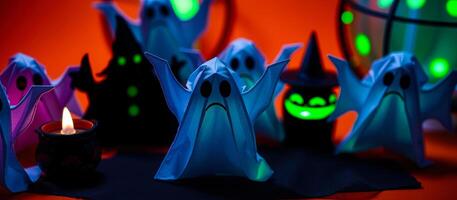 paper ghosts gather around a lighted cauldron photo