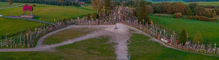 Hill of Crosses in Lithuania with Diverse Crosses and Greenery photo