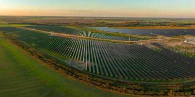Expansive Solar Farm in Rural Lithuania at Sunset photo