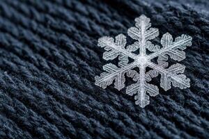 Intricate snowflake on dark background photo