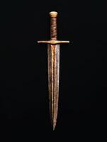 Antique sword with leather wrapped handle on black background photo