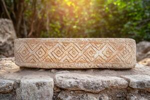 Carved stone block with intricate tribal patterns photo