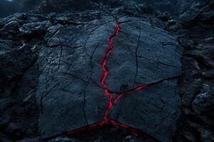 Glowing Lava Flowing Through Cracks in Dark Volcanic Rock photo