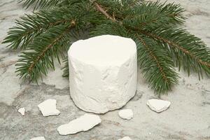Snowy white marshmallow on pine branches photo